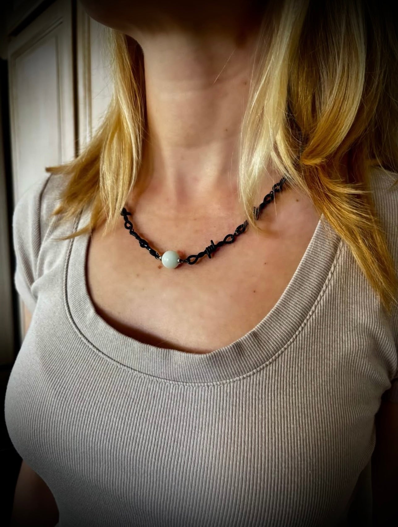 Black barbed wire necklace with glow stone