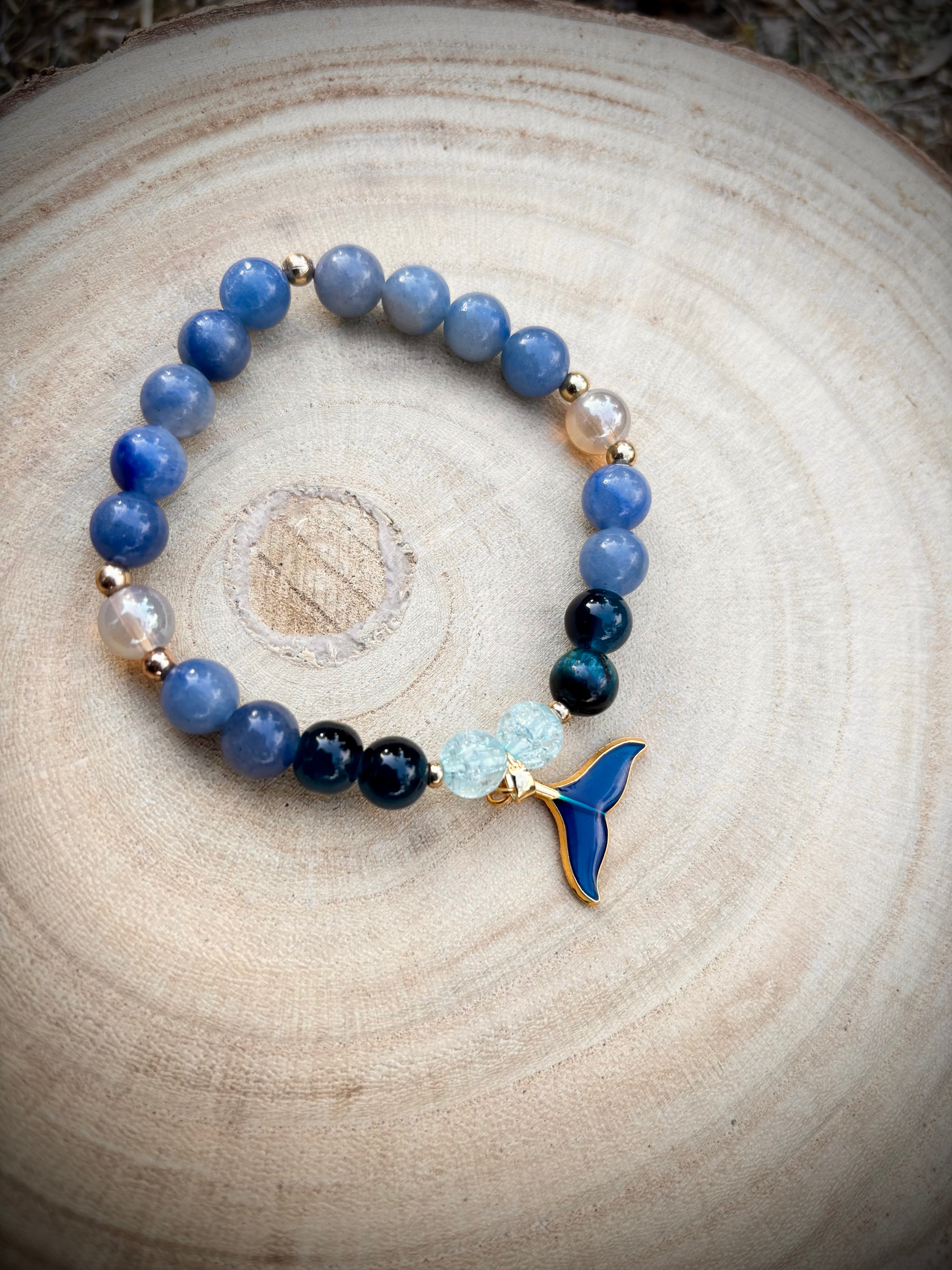 Deep blue sea glass whale tail