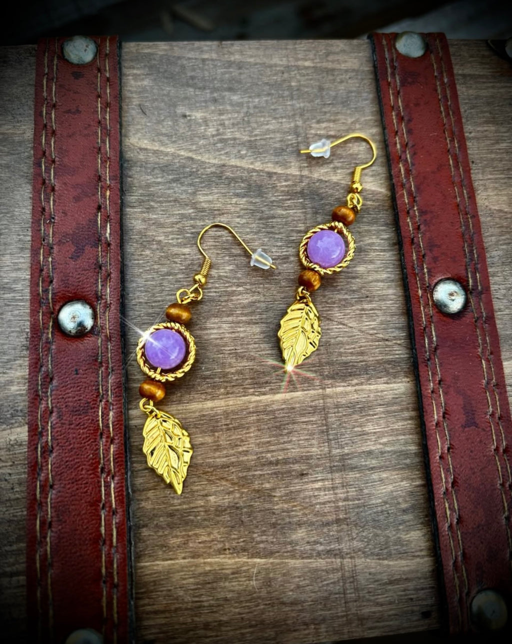 Purple stone and gold feather earrings