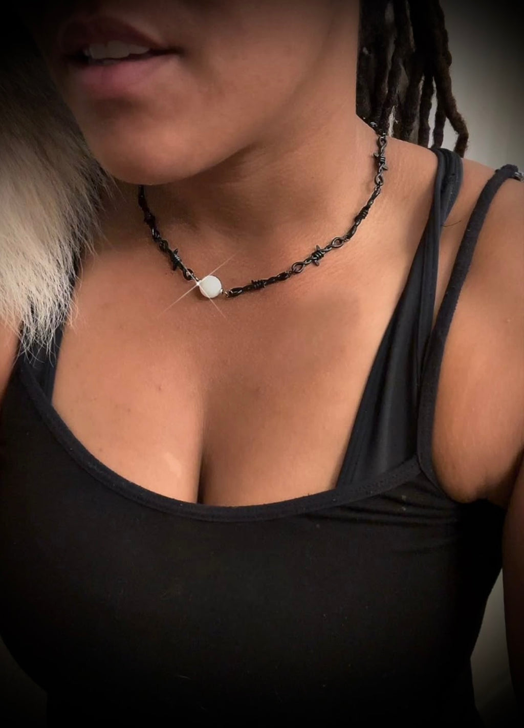 Black barbed wire necklace with glow stone