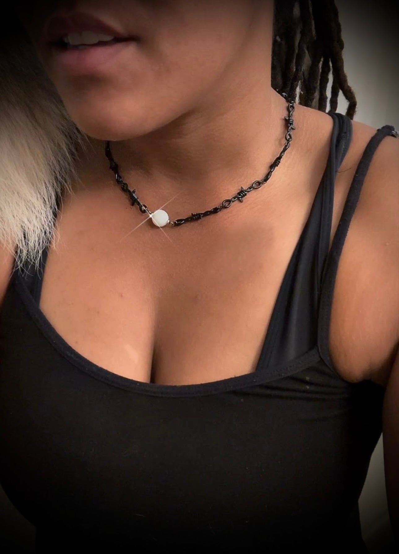 Black barbed wire necklace with glow stone