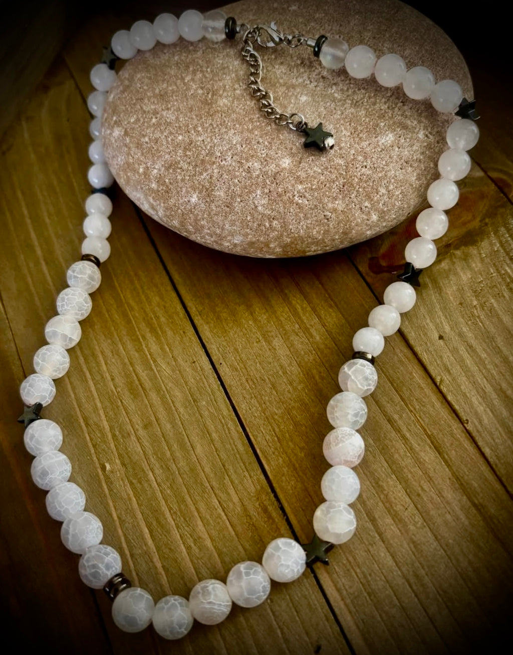 White stoned necklace with hematite star charms