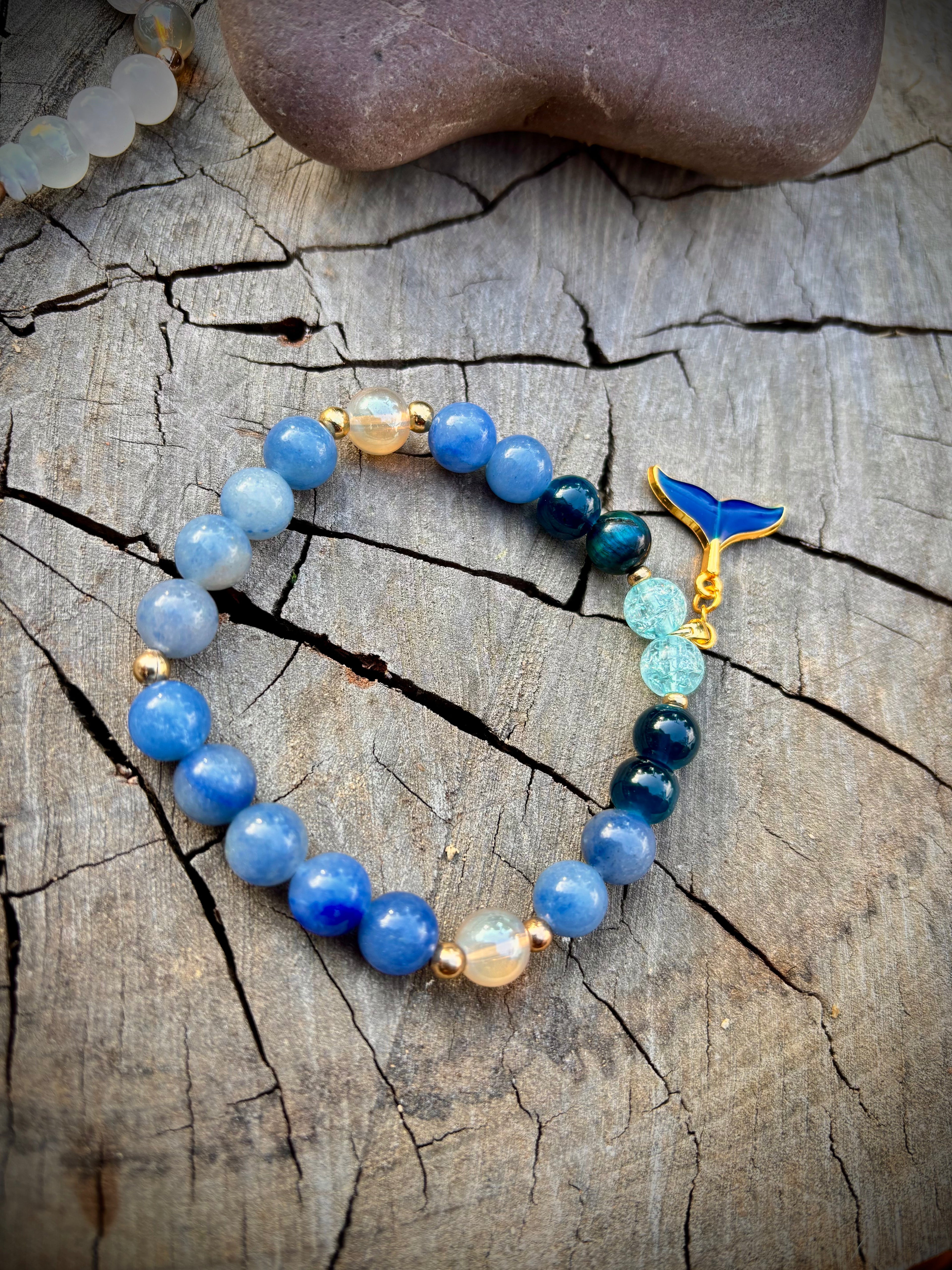 Deep blue sea glass whale tail