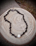 Black barbed wire necklace with glow stone