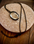 Black dandelion necklace