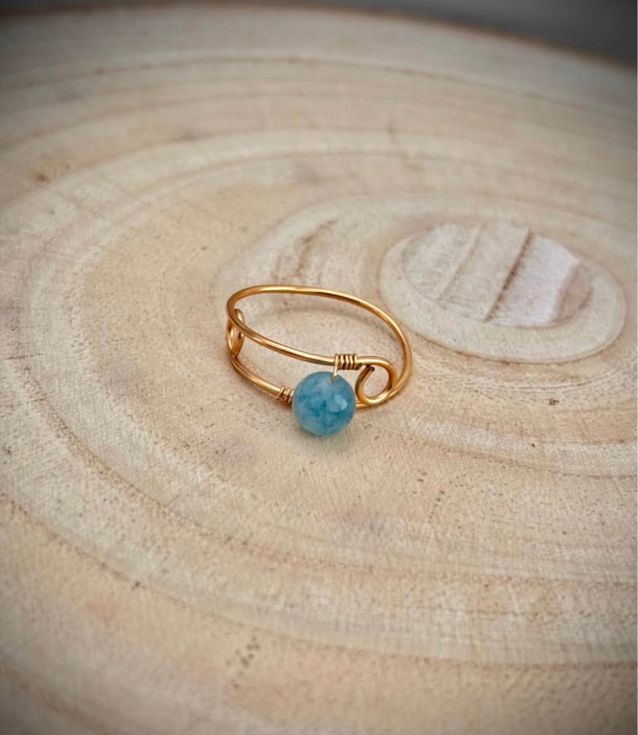 Gold wire wrap ring blue aquamarine