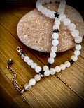 White stoned necklace with hematite star charms
