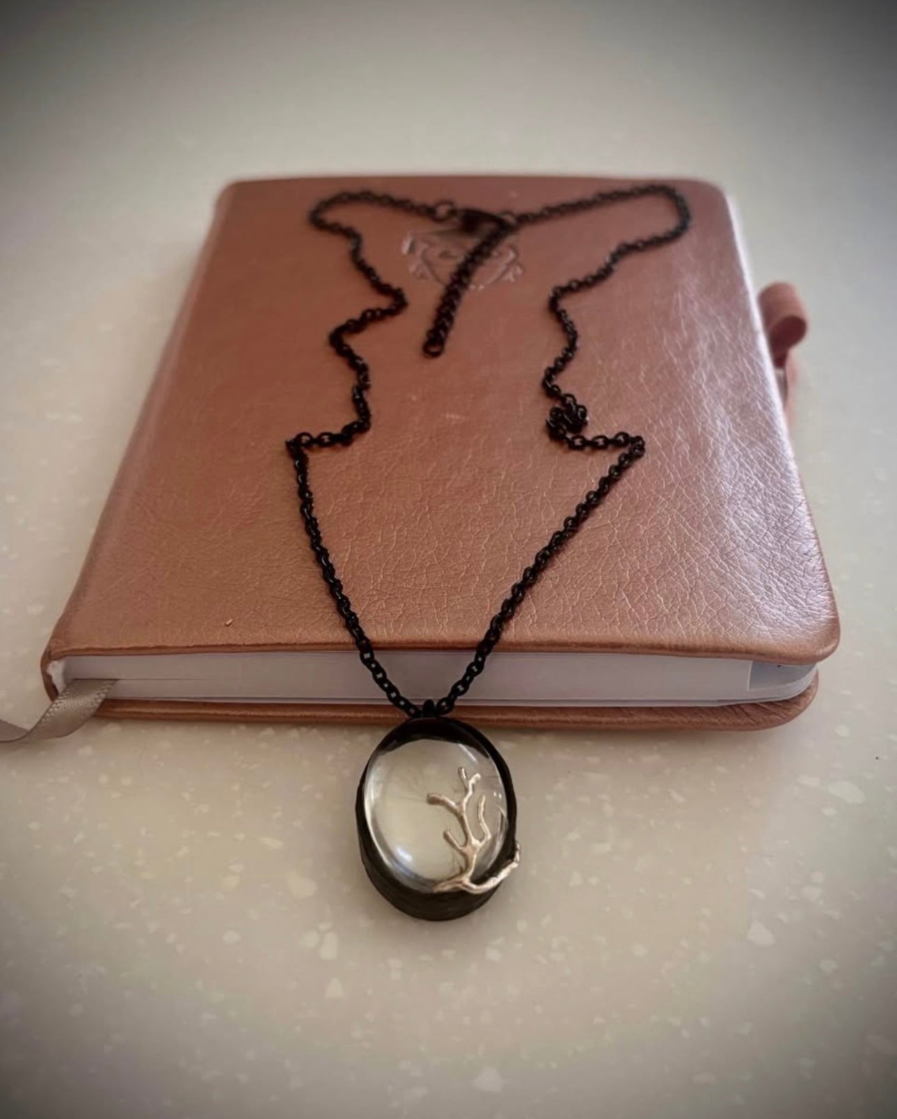 Black dandelion necklace