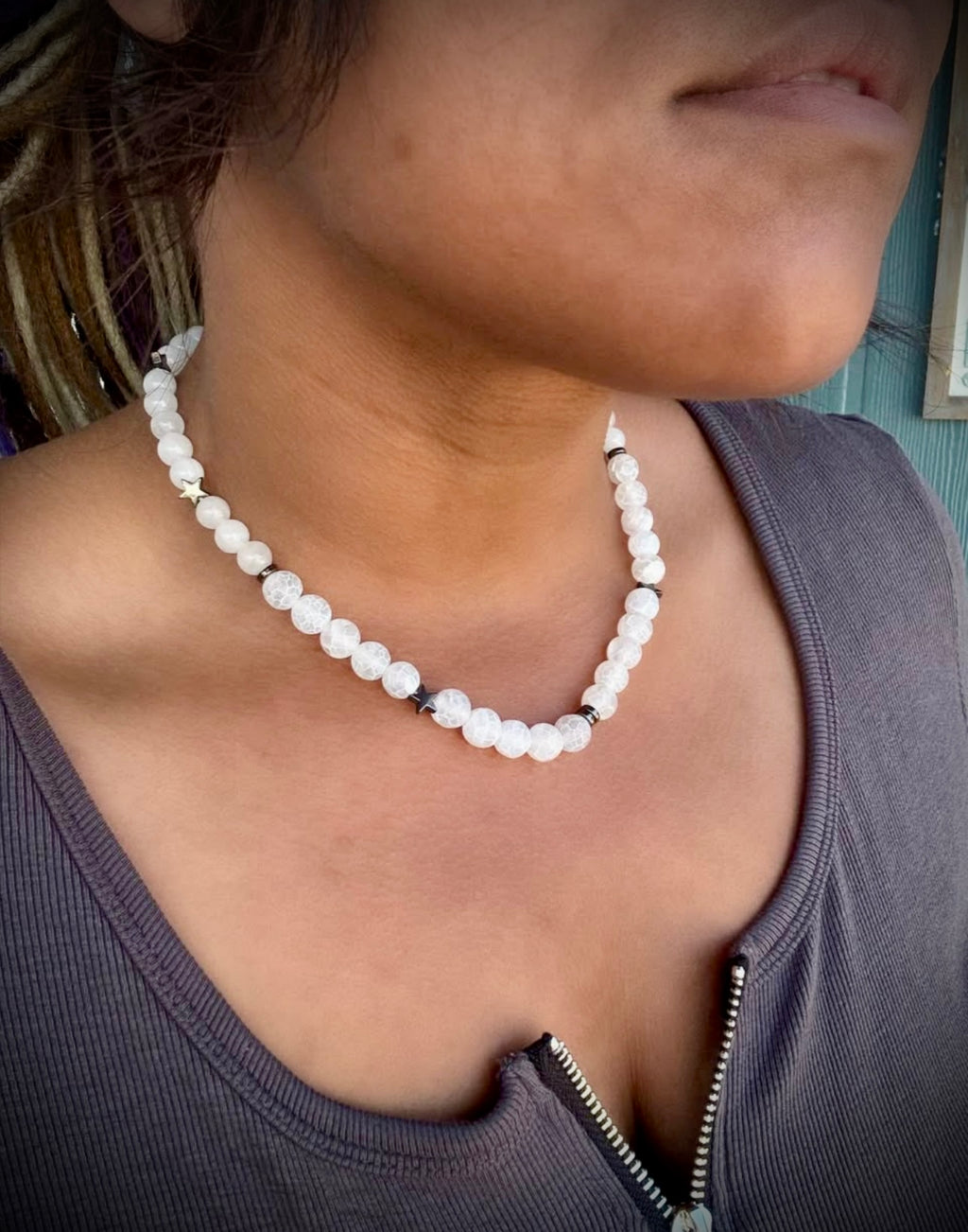White stoned necklace with hematite star charms