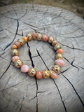 Rondelle glass and golden lava stone bracelet