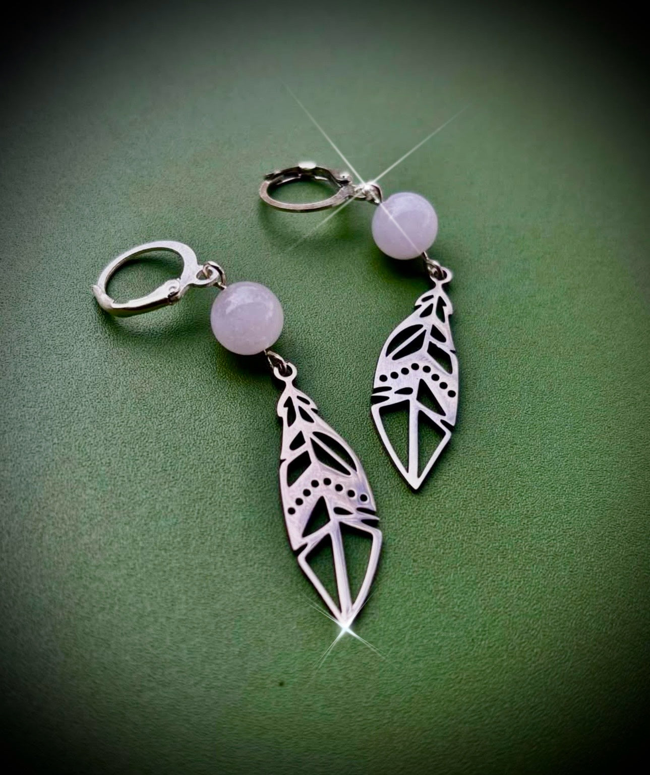 Silver feather drop earrings